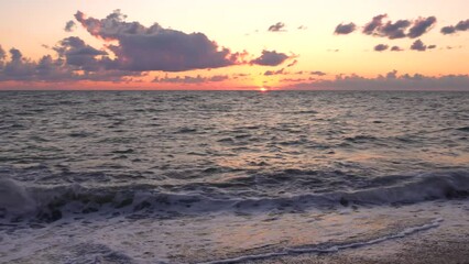 Wall Mural - The red sun sets in the sea. Red sunset
