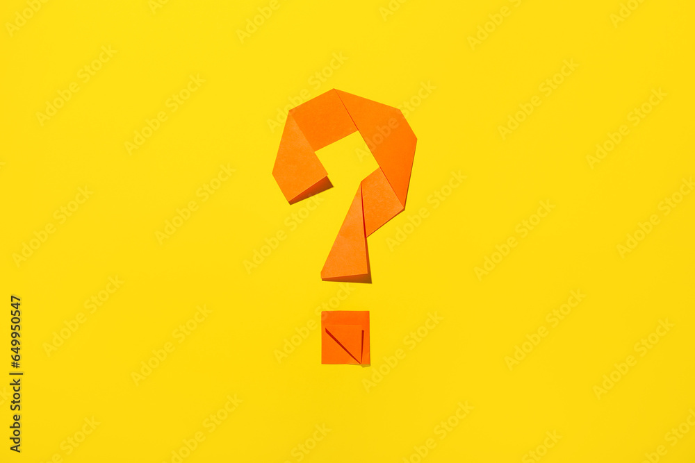Question mark made of paper on yellow background