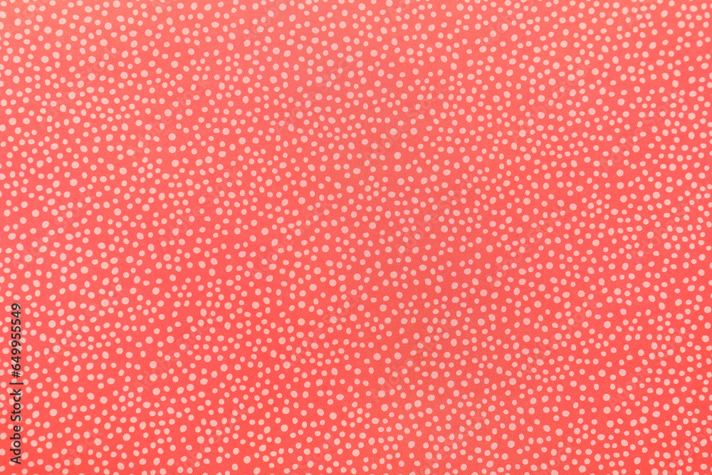 Closeup view of coral polka dot texture