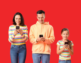 Poster - Happy family using mobile phones on red background