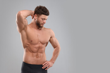 Poster - Handsome muscular man on light grey background, space for text. Sexy body