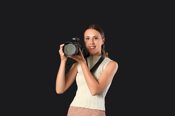 Wall Mural - Female photographer with camera in studio