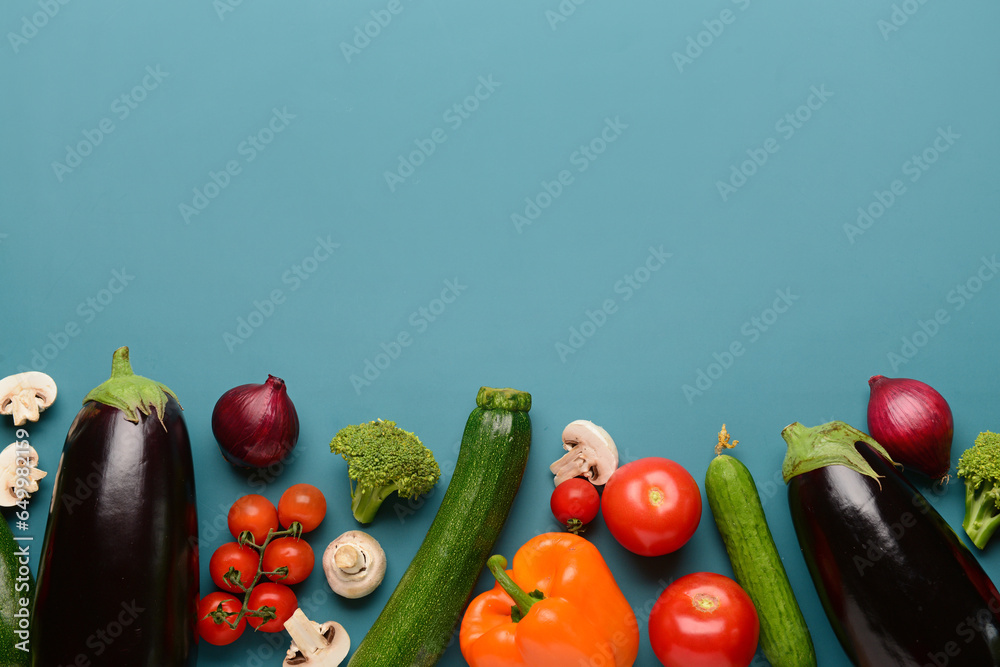 Different fresh vegetables on blue background