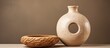 © AkuAku - Rustic style donut shaped clay beige vase for interior design