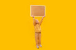 © somemeans - Full length portrait of little girl holding blank cork board under head. Isolated on yellow background. Space for text, mockup