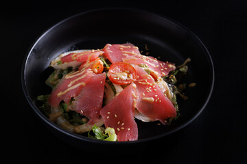 Wall Mural - Japanese salad isolated in black background