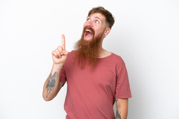 Wall Mural - Redhead man with long beard isolated on white background pointing up and surprised