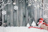 Fototapeta Na ścianę - Decorative Christmas Background Composed of a Snowman, a Giant Candy Stick and Various Gifts.