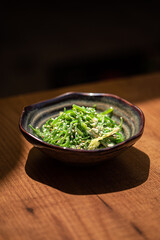 Wall Mural - Bowl of japanese chuka seaweed salad on table