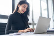© Charlie's - Beautiful confident asian business woman working with laptop Hands typing  keyboard. Professional investor working new start up project. business planning in office. Technology business
