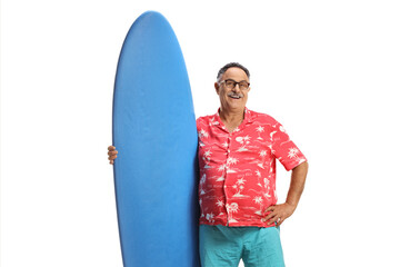 Wall Mural - Mature male tourist holding a surfing board