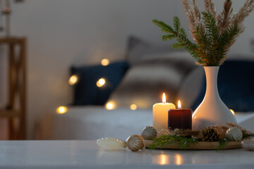 Wall Mural - burning candles with christmas decor in white cozy interior