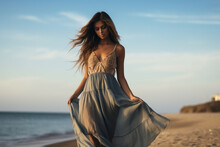 A Young And Beautiful Latin Woman Is Walking On The Sand Next To The Waterline With A Dress On A Tropical Beach With A Calm Ocean - Autumn Weather Beach Relaxing