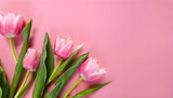 Fototapeta Tulipany - Springtime, pink tulips bouquet on pink background, top view. 