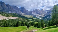 Breathtaking view of beautiful Alps mountains Dolomites, and Val Gardena Santa Cristina village ski resort in south Tyrol in northern Italy. Alpine nature scenery. 