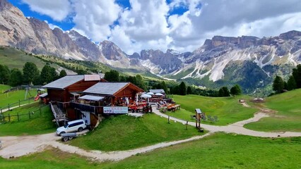 Wall Mural - Breathtaking view of beautiful Alps mountains Dolomites, and Val Gardena Santa Cristina village ski resort in south Tyrol in northern Italy. Alpine nature scenery. 