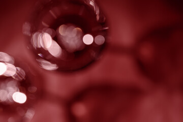 Wall Mural - glasses of red wine as blurred background, abstract backdrop red wine colored, natural light and dar