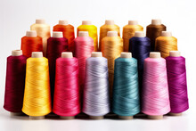 Vibrant threads and reels from textile factory isolated on a white background 