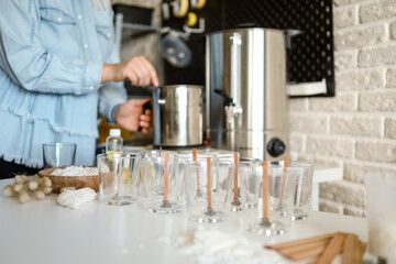 Wall Mural - Master makes candles in the workshop