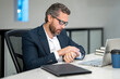 © Volodymyr - Office worker with laptop at office. Ofice employee remote working in modern office. Businessman on remote meeting, working online in offices place. Business man using computer in office.
