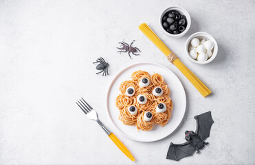 Wall Mural - Tomato sauce Halloween pasta with mozzarella cheese and black olives in the form of monster