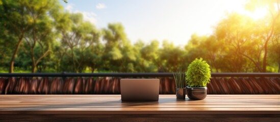 Poster - Nature view terrace with wooden flooring rattan and fabric furniture and a laptop on the table giving the impression of work