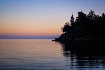 Canvas Print - a body of water with some trees near by in front of it