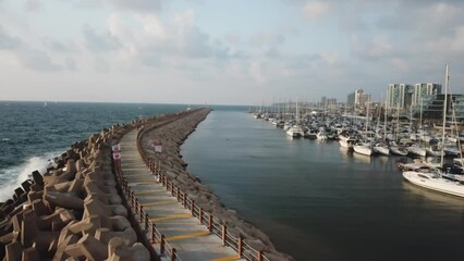 Sticker - Aerial view of coastline walking beach with boats moored at Marina Herzliya city in Israel