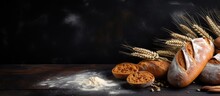 Country style bread or French baguette wheat and flour on blackboard Rural kitchen or bakery background with space for text