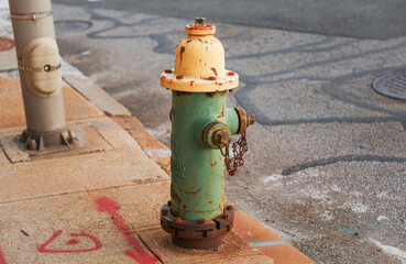 Wall Mural - fire hydrant stands tall on a sunny street corner, ready to protect and symbolize safety in urban environments