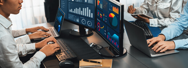 Poster - analyst working on data analysis or bi dashboard on computer monitor. business team analyzing financ