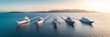 Top view of five yachts sailing in the sea captured from a high-quality drone
