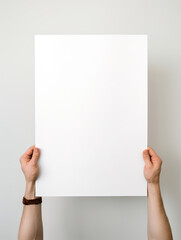 Hand holding empty blank photo paper frame on white background created with Generative AI Technology