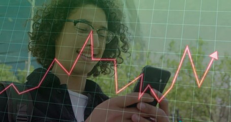 Poster - Animation of graphs and grid pattern over low angle view of smiling biracial man using cellphone