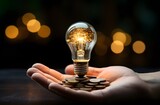 Idea Currency: Hand Holding Lightbulb with Coins