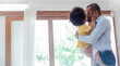 © paulaphoto - Portrait of american african black father and son hugging laughing in living room. Happy daddy and his little boy spending leisure time at home. Single dad, family lifestyle father's day concept