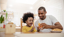 Portrait Of Happy African American Father And Son Hands Drink Eat During Breakfast Time At Dining Table With Copy Space. Single Dad Family Love Lifestyle, Father’s Day Warm Gentle Family.