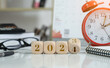 2024 new year idea concept. 2024 text on wooden blocks with data analysis and office concept background. Budgeting concept.