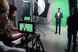 Videomaker shooting journalist for broadcast in professional studio