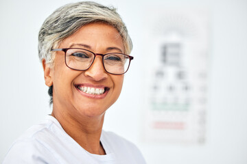 Poster - Senior woman, face and smile with glasses, vision and eye care in optometry clinic for eyesight test and chart. Happy in portrait, glaucoma and frame with prescription lens eyewear and mockup space