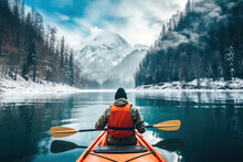 Kayak Adventure Man In A Boat On Peaceful Lake In Winter Landscape With Mountain View