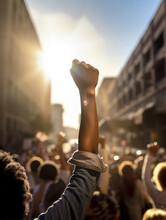 African American People In A Crowd Fighting And Protesting In The Street With Raised Fists Against Racism And Racial Discrimination, For Change, Freedom, Justice And Equality - Black Lives Matter