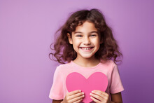 Little Girl Holding Pink Paper Heart Isolated On Purple Background