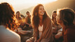 © Keitma - Young woman leading a group of people in laughter yoga session on a mountaintop at sunrise, their laughter echoes through the serene landscape as they embrace the healing power of laughter and nature