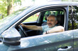 © F8  \ Suport Ukraine - Mature successful businessman riding in the car in the city