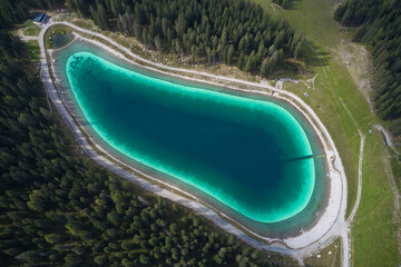 Canvas Print - Montagnoli Lake. Aerial view of Trentino Montagnoli lake. Alpine lake in the mountains, top view. Perspective aerial view of the Montagnoli lake in Trentino.  Blue lake in the Alps.