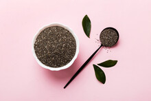 Chia Seeds In Bowl And Spoon On Colored Background. Healthy Salvia Hispanica In Small Bowl. Healthy Superfood