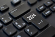 2024 written on enter key on a computer keyboard, business new year start illustration