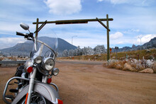 American Motorcycle Parked At Ranch Entrance Gate After Blizzard In The Colorado Rocky Mountains