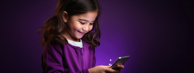 Poster - Little smiling girl with a cell phone on a colored background.